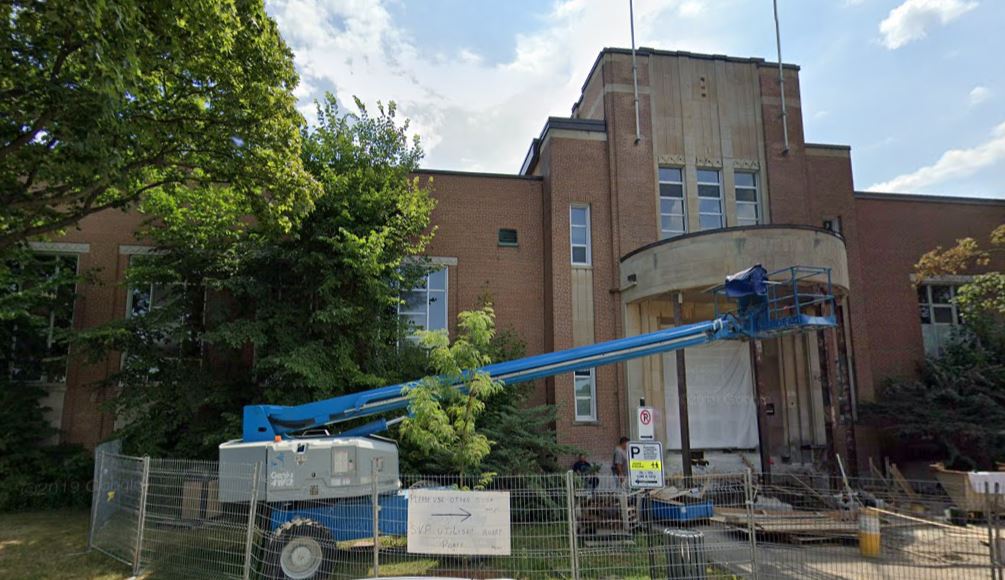 Photo of MRHS Entrance with Name Scraped Off